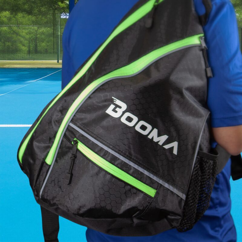 BOOMA's pickleball sling bag on a peson's back.