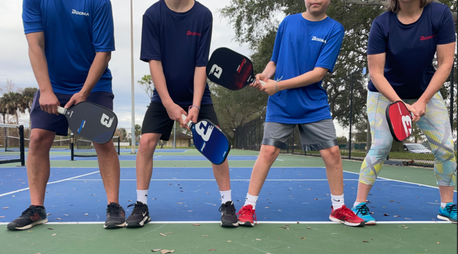 BOOMA family on pickleball court.